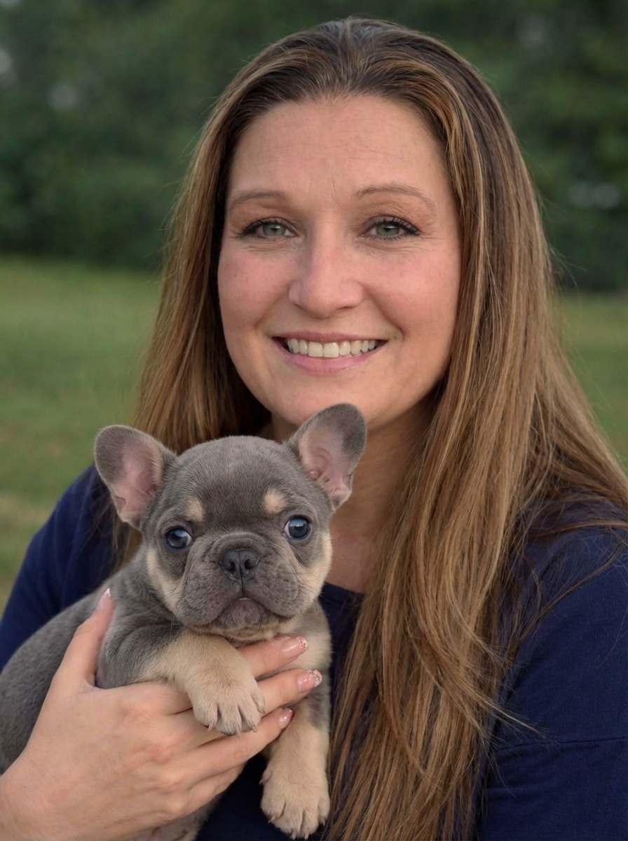 Crystal, founder of Puppy Safe, with a newborn puppy